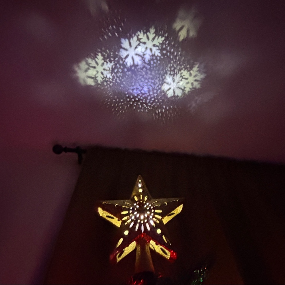 Christmas Tree Topper with Snowflake Projector Light on ceiling